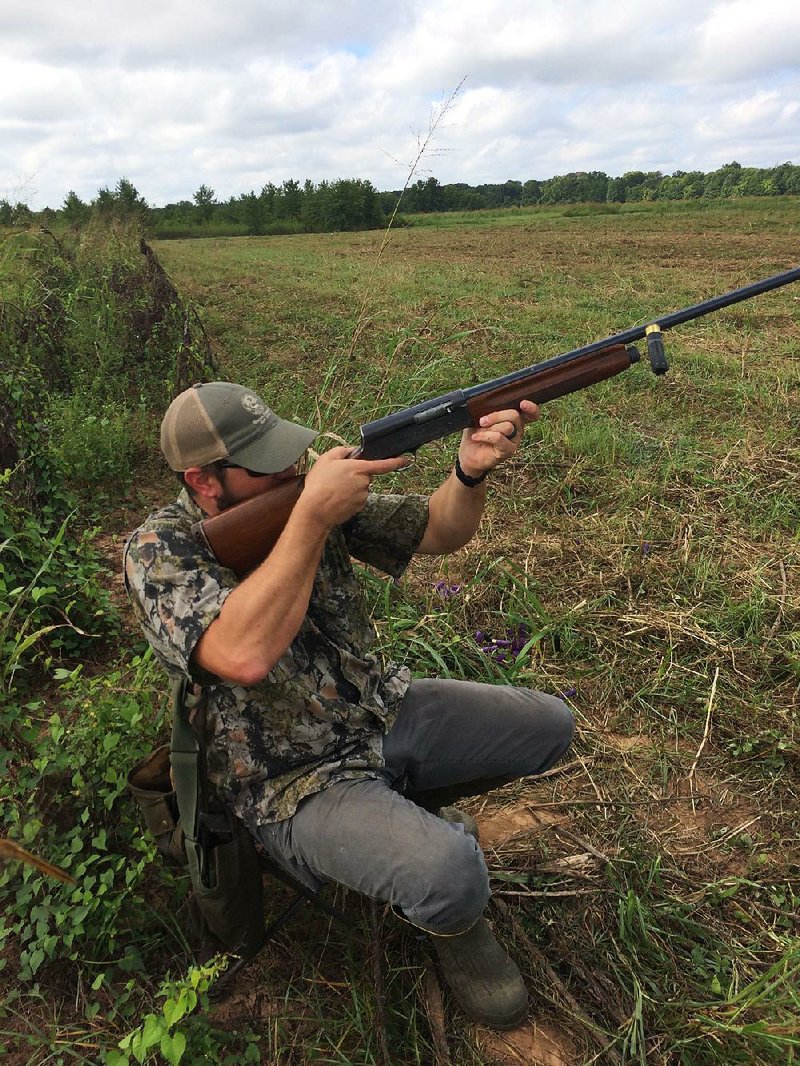 A hull flies from Dusty McDaniel’s 16-gauge Remington Model 11 on Sunday as he fires at a dove in Pulaski County.