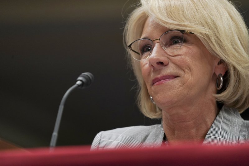 In this June 5, 2018, file photo, Education Secretary Betsy DeVos pauses as she testifies on Capitol Hill in Washington. Preliminary data obtained by The Associated Press show the Trump administration is granting only partial loan forgiveness to the vast majority of students it approves for help because of fraud by for-profit colleges. T (AP Photo/Carolyn Kaster, File)
