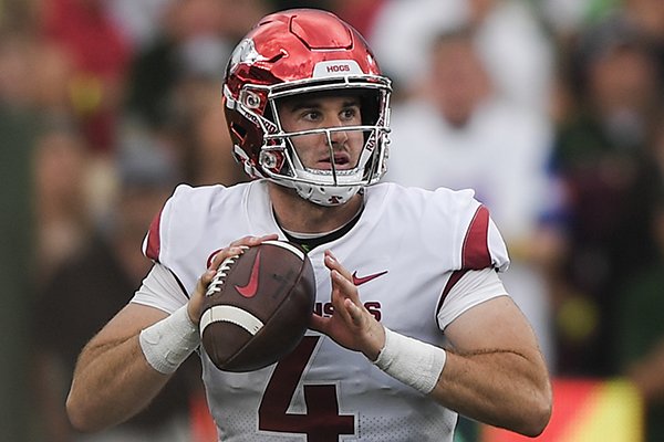 Arkansas Razorbacks quarterback Ty Storey (4) looks for a receiver during the second quarter of a football game, Saturday, September 8, 2018 at Colorado State University in Fort Collins, Colo.