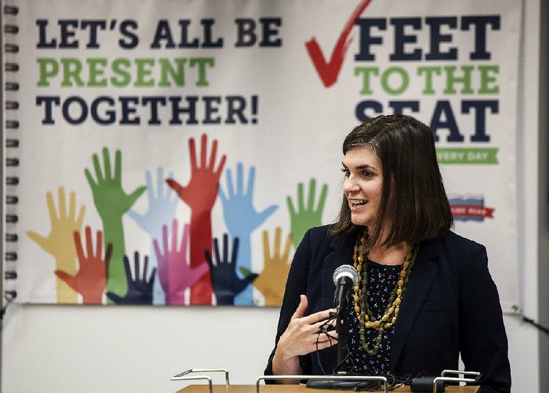 Mollie Palmer, director of marketing and communications for the Heart of Arkansas United Way, speaks Thursday at Terry Elementary School to announce the Feet to the Seat Campaign, which aims to address chronic absenteeism in the Little Rock School District.