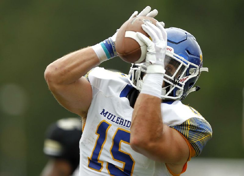Southern Arkansas wide receiver Jared Lancaster pulls in a touch- down reception during the fourth quarter of the Muleriders’ 28-23 victory over Harding on Sunday at First Security Stadium in Searcy. Lancaster’s score gave the Muleriders a 21-17 lead they held the remainder of the way.