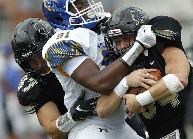 Arkansas Democrat-Gazette/THOMAS METTHE -- 9/9/2018 --
Southern Arkansas defensive lineman Prince Udenze (91) tackles Harding running back Cole Chancey (34) for a loss during the fourth quarter of SAU's 28-23 win on Sunday, Sept. 9. 2018, at First Security Stadium in Searcy. 