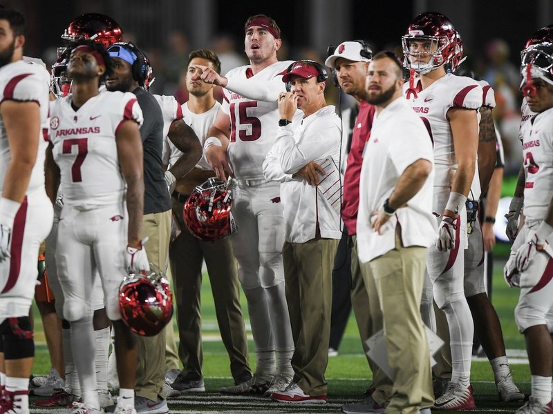 NWA Democrat-Gazette/CHARLIE KAIJO Arkansas Razorbacks head coach Chad Morris and quarterback Cole Kelley (15) watch a play review for a Kelley touchdown ruled incomplete during the third quarter of a football game, Saturday, September 8, 2018 at Colorado State University in Fort Collins, Colo. 


