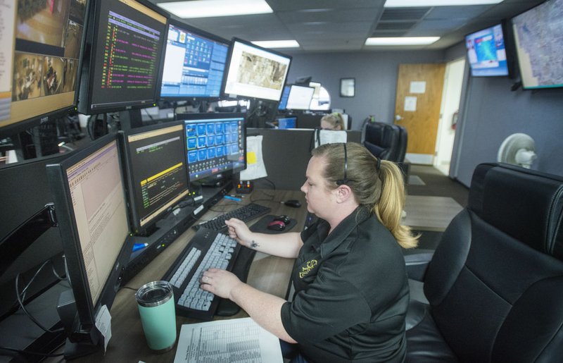 NWA Democrat-Gazette/BEN GOFF &#8226; @NWABENGOFF Lacy Sprinkles dispatches calls for the Springdale Fire Department Thursday in the dispatch room at the Springdale Police Department.