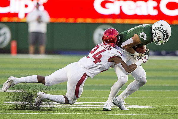 Jarques McClellion, Arkansas cornerback, tackles Olabisi Johnson, Colorado State wide receiver, in the 2nd quarter Saturday, Sept. 8, 2018, at Canvas Stadium in Fort Collins, Colo.