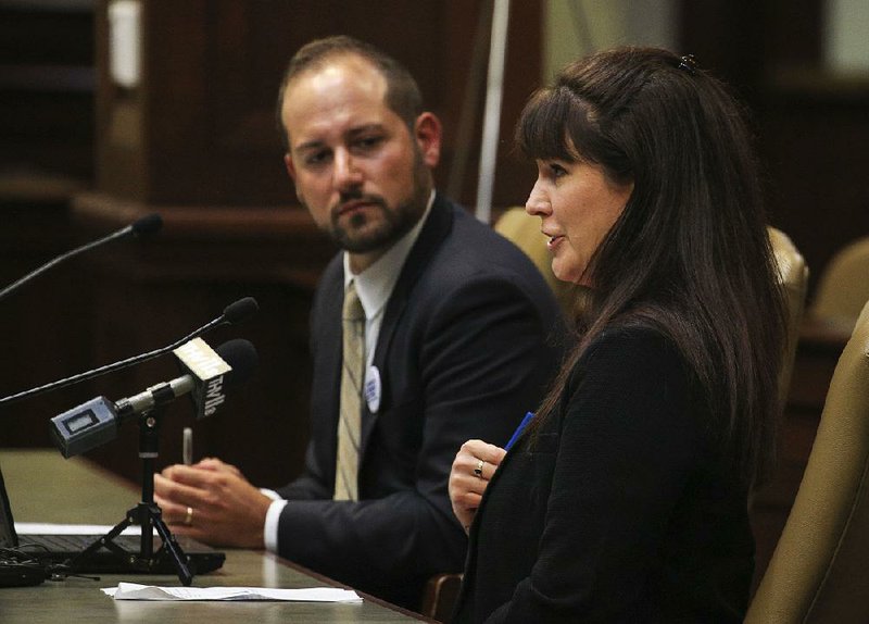 Eve Jorgensen (right), state chapter president with Moms Demand Action, answers a question Monday along with Joseph Giannetto, associate regional director with Everytown for Gun Safety, during a legislative committee meeting at the state Capitol in Little Rock.