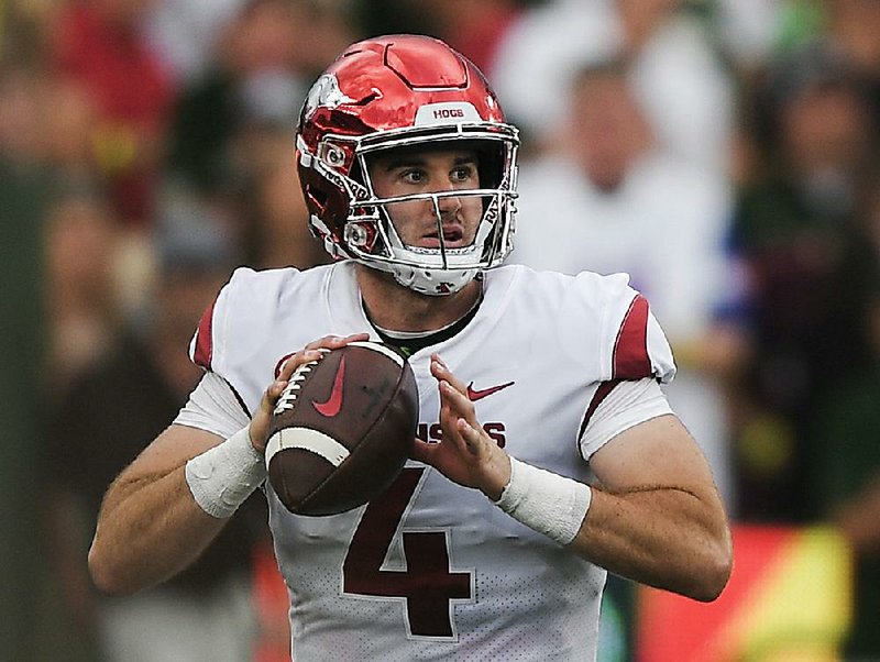 NWA Democrat-Gazette/CHARLIE KAIJO Arkansas Razorbacks quarterback Ty Storey (4) looks for a receiver during the second quarter of a football game, Saturday, September 8, 2018 at Colorado State University in Fort Collins, Colo. 

