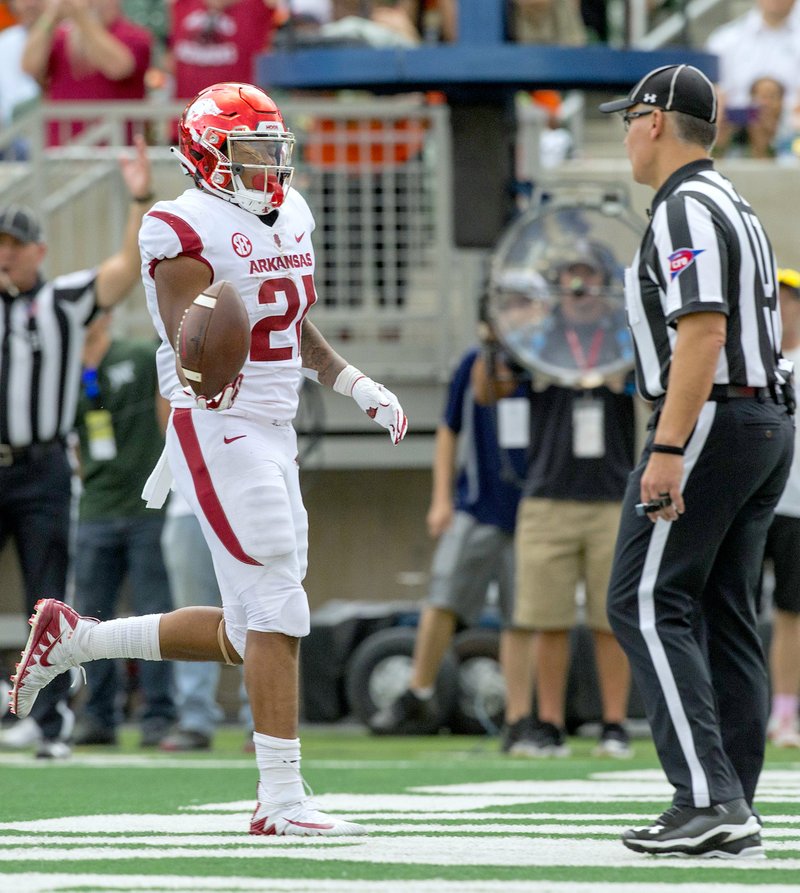 NWA Democrat-Gazette/Ben Goff RUNNING GAME: Arkansas running back Devwah Whaley scores a touchdown in the second quarter Saturday in Fort Collins, Colo., during the Razorbacks' 34-27 loss at Colorado State.