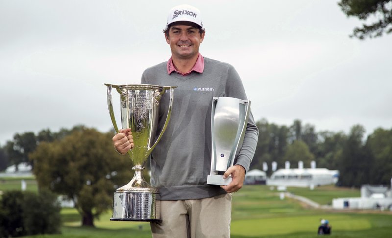 The Associated Press DRIVING MACHINE: Keegan Bradley poses with the two trophies following his win on Monday at the BMW Championship golf tournament at the Aronimink Golf Club in Newtown Square, Pa.