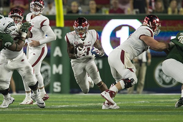Arkansas running back Devwah Whaley carries the ball during a game against Colorado State on Saturday, Sept. 8, 2018, in Fort Collins, Colo.