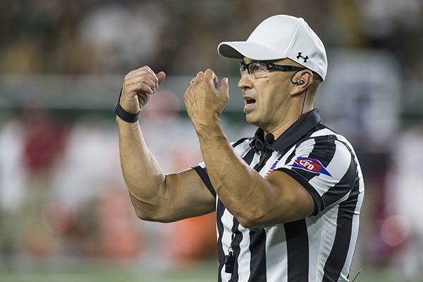 Mountain West Conference referee Matt Campbell explains a call during a game between Arkansas and Colorado State on Saturday, Sept. 8, 2018, in Fort Collins, Colo.