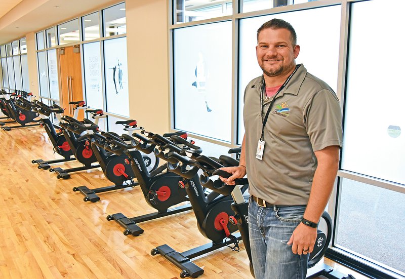 Brandon Shrader, recreation superintendent for the Batesville Community Center and Aquatics Park, stands in the center’s fitness room. The Inaugural Indoor Triathlon is scheduled for Sept. 22 in the center, and the biking will be done on exercise bicycles. Registration can be completed online at batesvilleparks.com. To get a T-shirt, the registration deadline is Tuesday.