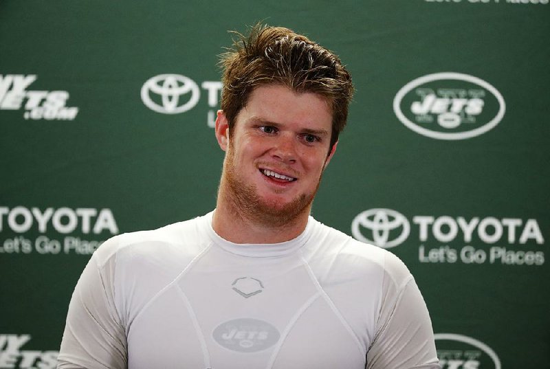 In this Sept. 10, 2018, file photo, New York Jets quarterback Sam Darnold smiles while listening to a question after an NFL football game against the Detroit Lions in Detroit. Darnold bounced back from a brutal beginning and the New York Jets ended up rolling to a rout. 