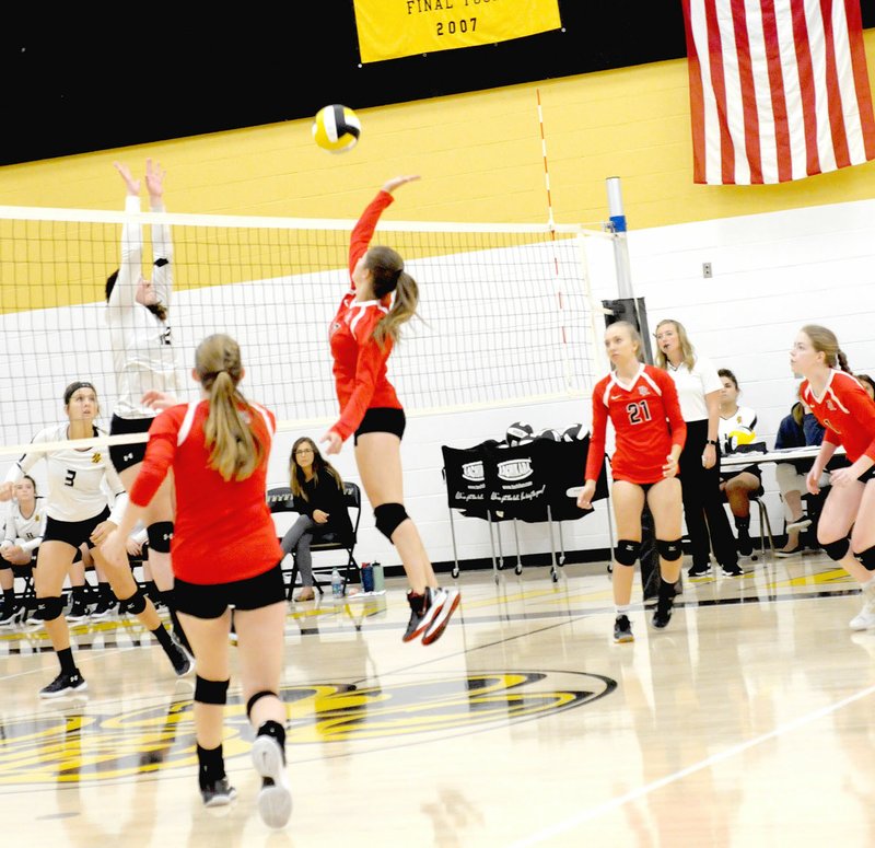 MARK HUMPHREY ENTERPRISE-LEADER Prairie Grove and Pea Ridge players battle at the net during a Thursday, Sept. 6, 2018 match won by the Lady Blackhawks, 25-16, 25-14, 25-19.
