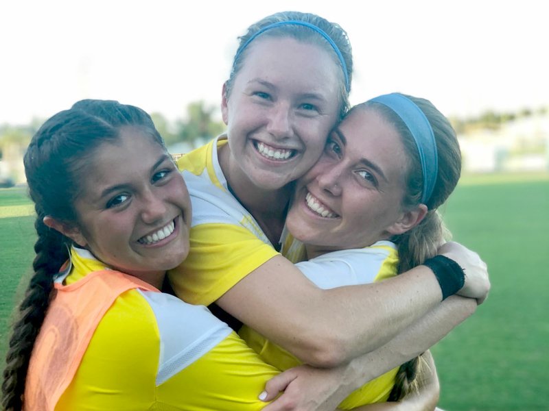Photo submitted John Brown University women's soccer players Natalie Aycock, Sienna Nealon and Aspen Carpenter celebrate after Nealon scored the game winning penalty kick last Saturday against William Carey (Miss.) in Orange Beach, Ala.