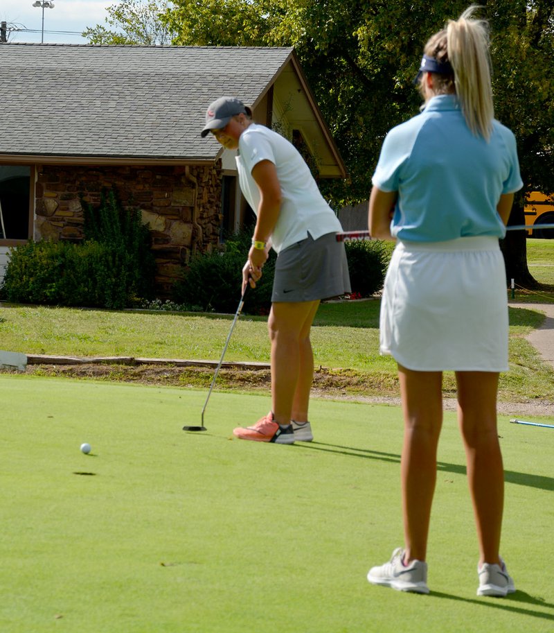 Graham Thomas/Herald-Leader Siloam Springs senior McKenzie Blanchard attempts a putt on hole No. 9 Monday in a nine-hole tri-match with Springdale Har-Ber and Van Buren at Siloam Springs Country Club.