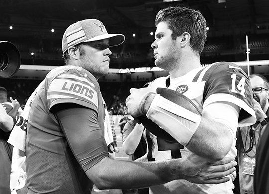 The Associated Press QB CONTRAST: Lions quarterback Matthew Stafford, left, meets with New York quarterback Sam Darnold Monday after the Jets' 48-17 win Monday in Detroit.