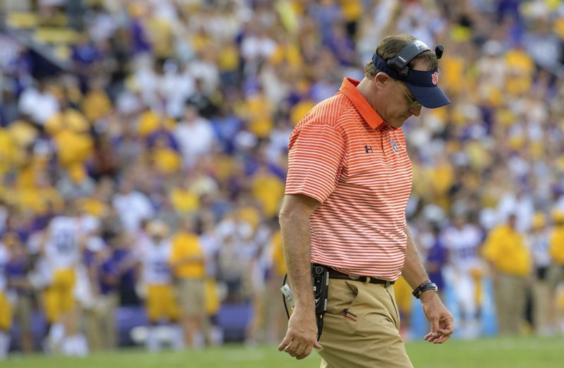 In this Oct. 14, 2017, file photo, Auburn head coach Gus Malzahn reacts as his team falls behind to LSU in the second half during an NCAA college football game, in Baton Rouge, La. No. 7 Auburn, it turns out, had more meaningful losses than the LSU game last season, but that one was certainly painful after blowing a 20-0 lead.