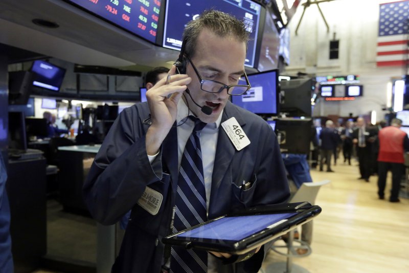 In this Sept. 6 2018, file photo trader Gregory Rowe works on the floor of the New York Stock Exchange. (AP Photo/Richard Drew, File)