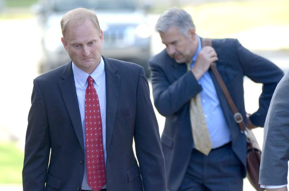 Former Ecclesia College President Oren Paris III walks Wednesday, Sept. 12, 2018, into the John Paul Hammerschmidt Federal Building in Fayetteville. 