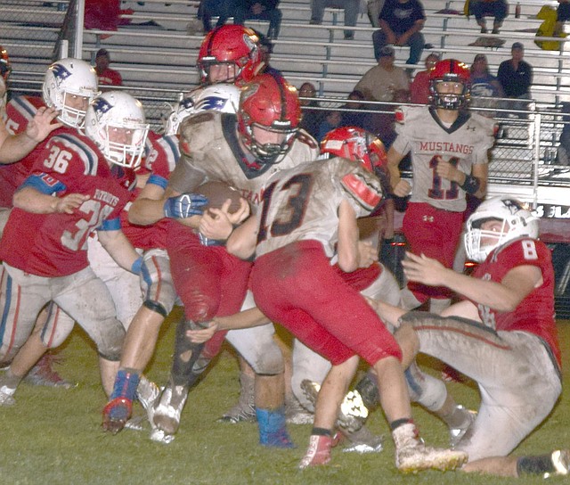 Rick Peck/Special to McDonald County Press McDonald County running back cuts off a block by (Reece Cooper) for a big gain during the Mustangs' 38-8 win over the East Newton Patriots on Sept. 7 at East Newton High School. Roessler finished the game with 352 rushing yards on 30 carries and five touchdowns.