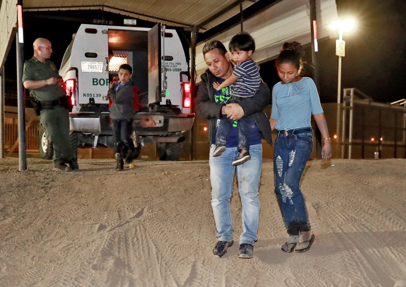 The Associated Press DETAINED AT BORDER: A Honduran man carries his 3-year-old son as his daughter and other son follow to a transport vehicle after being detained by U.S. Customs and Border Patrol agents on July 18 in San Luis, Ariz. Border arrests figures for August are the latest reminder of how crossings have shifted over the last decade from predominantly Mexican men to Central American families and children. The number of family arrivals reached 15,955, a sharp increase from July that Customs and Border Protection Commissioner Kevin McAleenan said was one of the highest on record.