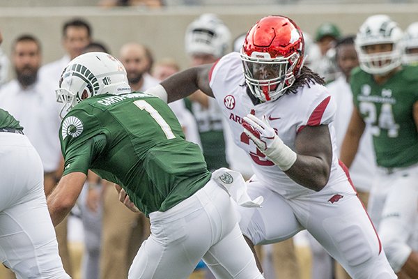 Arkansas defensive lineman McTelvin Agim chases down Colorado State quarterback K.J. Carta-Samuels during a game Saturday, Sept. 8, 2018, in Fort Collins, Colo.