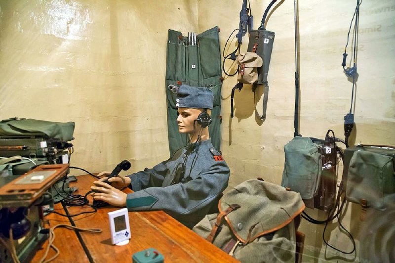 A mannequin holding 1940s communication gear sits inside Fortress Furigen, a decommissioned bunker near Luzern that provides a peek at Switzerland’s hidden defense system. 