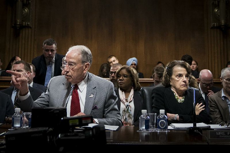 Senate Judiciary Chairman Charles Grassley leads a committee session Thursday on Capitol Hill, a day after ranking Democratic member Dianne Feinstein (right) referred to the FBI a letter containing possibly damaging information about Supreme Court nominee Brett Kavanaugh. Feinstein had not shared the letter with Grassley, who said the matter would not affect the panel’s consideration of the nomination. 