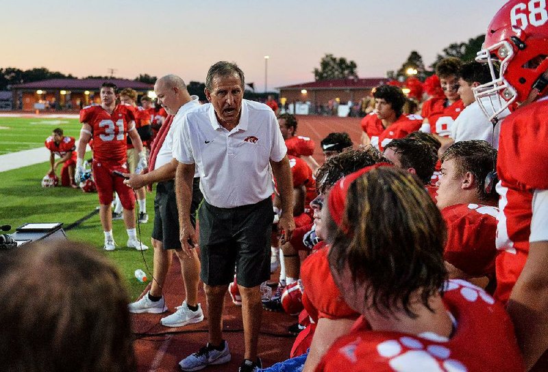 Cabot Coach Mike Malham (left) gives instructions to his team during the Panthers’ 35-14 victory over Pine Bluff on Aug. 31. Malham, 65, will have his first chance at career victory No. 300 tonight when Cabot takes on Benton. He would become just the second high school football coach in Arkansas with at least 300 career victories.