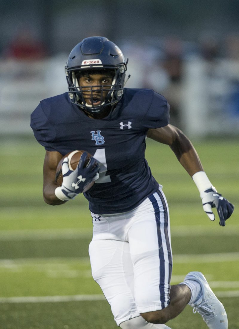 NWA Democrat-Gazette/BEN GOFF @NWABENGOFF Micah Seawood, Springdale Har-Ber wide receiver, runs for extra yards Friday, Aug. 24, 2018, during the game against Pulaski Academy at Wildcat Stadium in Springdale. The Wildcats will be on the road tonight at Pine Bluff in their final nonconference game of the season.