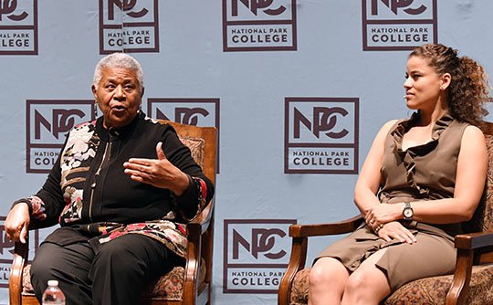 The Sentinel-Record/Grace Brown LIVING HISTORY: Minnijean Brown Trickey, left, and her daughter, Spirit Tawfiq, speak to capacity crowds Thursday at National Park College about Brown Trickey's experiences as a member of the Little Rock Nine. The event was hosted by the NPC Cultural Diversity Awareness Club's "We Belong" speaker series.