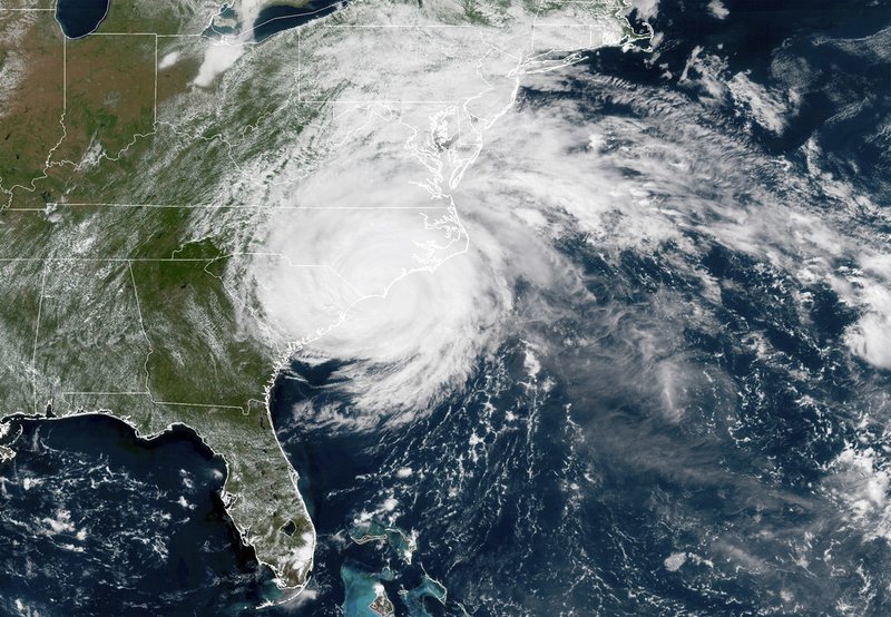 This satellite image provided by NOAA shows Hurricane Florence on the eastern coast of the United States on Friday, Sept. 14, 2018. (NOAA via AP)

