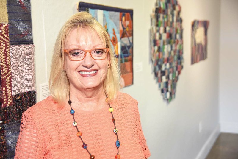Deborah Kuster, a professor at the University of Central Arkansas in Conway and a fiber artist, has a display of her works at UCA Downtown. The exhibit features hand-woven textiles and vessels. Kuster plans to retire from UCA in May.
