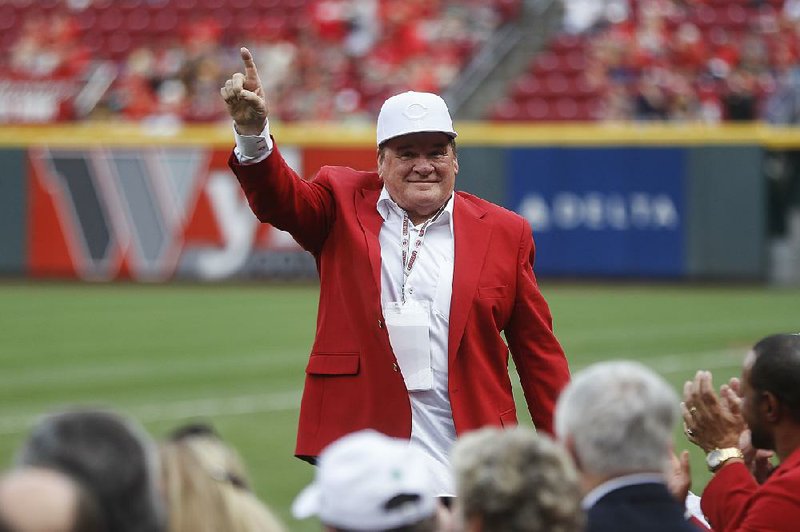 Former Cincinnati Reds player and manager Pete Ross acknowledges spectators during a Cincinnati Reds Hall of Fame induction ceremony before a July 21 game against the Pittsburgh Pirates in Cincinnati. The all-time baseball hits leader said he “can barely walk” and is in “poor health” in divorce proceedings.