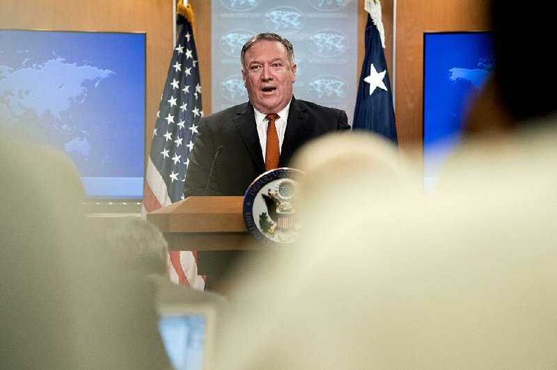 Secretary of State Mike Pompeo speaks Friday at the State Department, where he accused his predecessor under President Barack Obama, John Kerry, of “actively undermining” U.S. policy on Iran. 