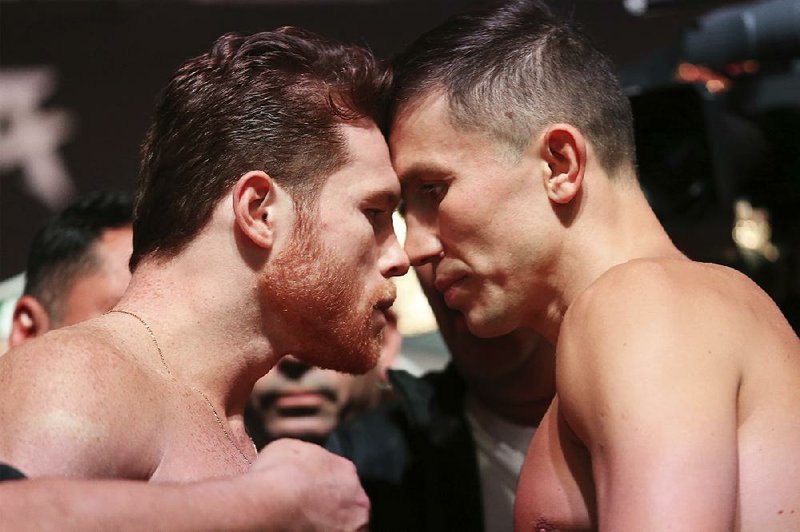 Canelo Alvarez (left) and Gennady Golovkin pose during a weigh-in Friday at T-Mobile Arena in Las Vegas. Alvarez and Golovkin will fight tonight in a middleweight title bout.
