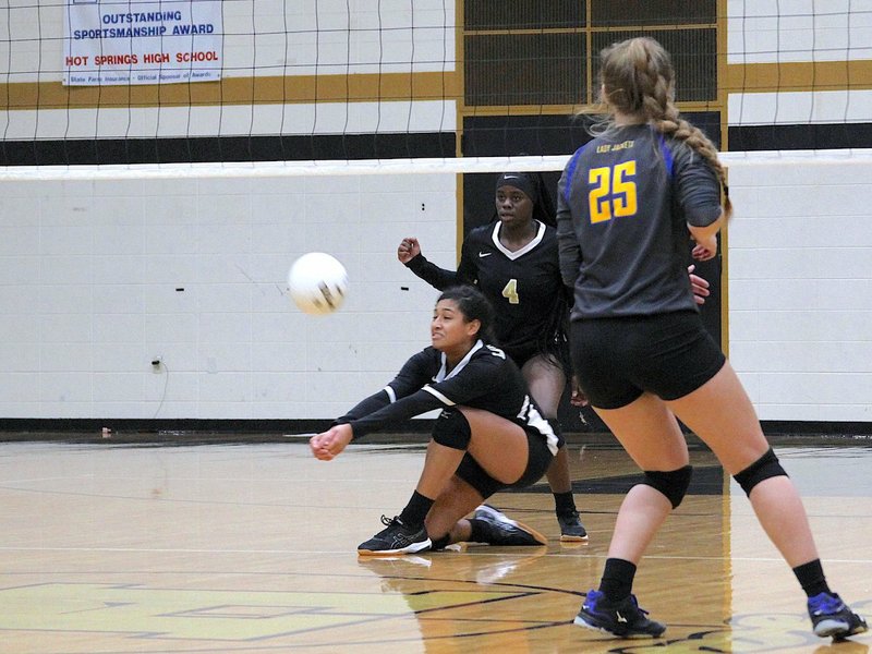 The Sentinel-Record/James Leigh DOWN BUT NOT OUT: Hot Springs sophomore Emma Campus digs a shot Thursday in the first set of the Lady Trojans' five-set loss at home against Sheridan.