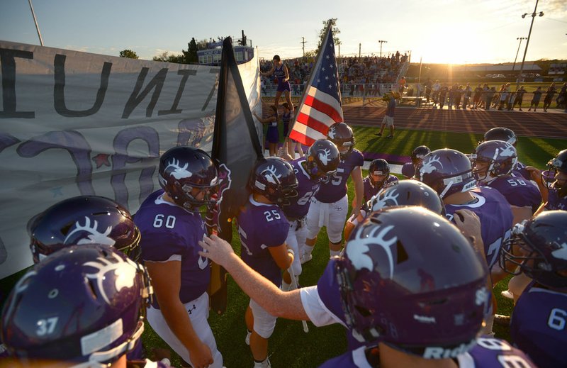 NWA Democrat-Gazette/ANDY SHUPE Elkins players prepare to enter the field for the first time against Huntsville Friday, Sept. 14, 2018, at John Bunch Jr. Stadium in Elkins. Visit nwadg.com/photos to see more photographs from the game.