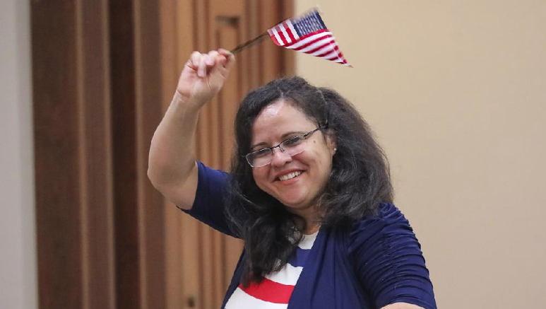 Rose Draper celebrates becoming a U.S. citizen during Friday’s naturalization ceremony at the U.S. District Court building in Little Rock. 