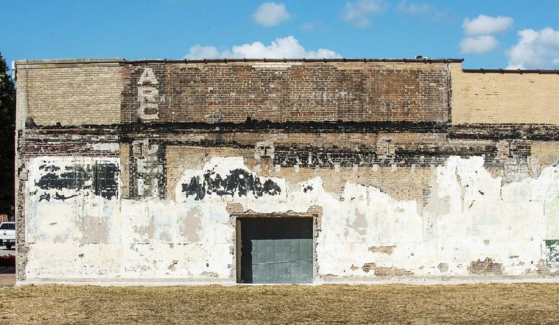 Demolition of a building in downtown Springdale revealed a wall from the Arcade Hotel, which was torn down in the 1940s. There are ghost signs for the hotel on the wall, which was apparently used as one of the four walls of a department store building. An addition to the store covered the signs from the Arcade Hotel.