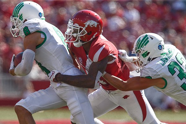 North Texas receiver Rico Bussey Jr. (8) runs with the ball during a game against Arkansas on Saturday, Sept. 15, 2018, in Fayetteville. 