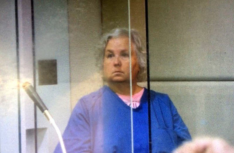 In this Sept. 6, 2018, screen shot from video during her court appearance, Nancy Brophy appears in Multnomah County Circuit Court in Portland, Ore. The self-published romance writer being held in her husband's death has now been indicted on a murder charge. (Multnomah County Circuit Court /The Oregonian via AP, File)