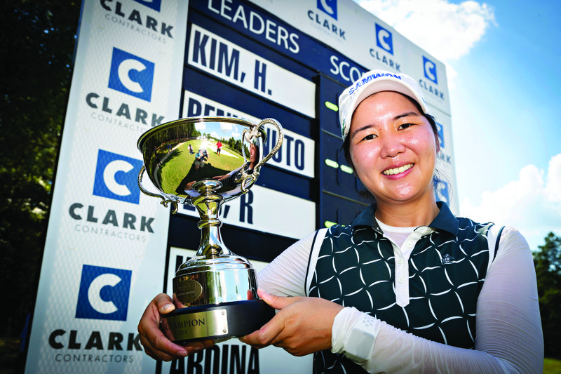 Hyemin Kim holds up the trophy after winning the Murphy USA El Dorado Shootout Sunday at Mystic Creek. The South Korean was three strokes ahead of the field in winning her second event on the Symetra Tour.
