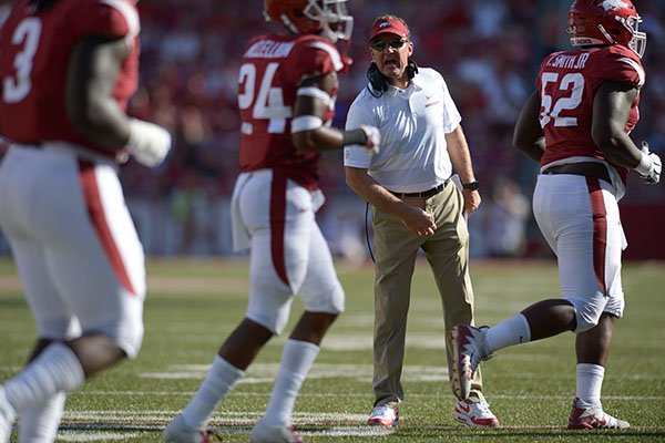 Arkansas coach Chad Morris speaks to his players against North Texas Saturday, Sept. 15, 2018, during the second quarter at Razorback Stadium in Fayetteville. 