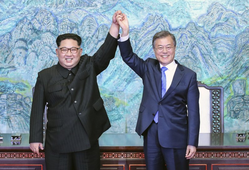 FILE - In this April 27, 2018 file photo, North Korean leader Kim Jong Un, left, and South Korean President Moon Jae-in raise their hands after signing a joint statement at the border village of Panmunjom in the Demilitarized Zone, South Korea. South Korea&#x2019;s liberal president faces growing skepticism at home about his engagement policy ahead of his third summit with North Korean leader Kim Jong Un. A survey showed nearly half of South Koreans think next week&#x2019;s summit won&#x2019;t find a breakthrough to resolve a troubled nuclear diplomacy. It comes as Moon&#x2019;s approval rating is declining amid economic frustrations. (Korea Summit Press Pool via AP, File)