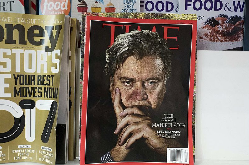 An issue of Time magazine is displayed on a New York newsstand in November. Salesforce co- founder Marc Benioff and his wife are buying the magazine from Meredith Corp. for $190 million. 