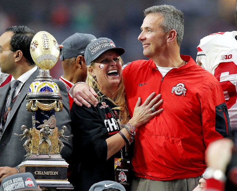 Ohio State Coach Urban Meyer (right) returns for the Buckeyes’ game Saturday after serving a three-game suspension for his role in the mismanagement of former assistant coach Zach Smith.