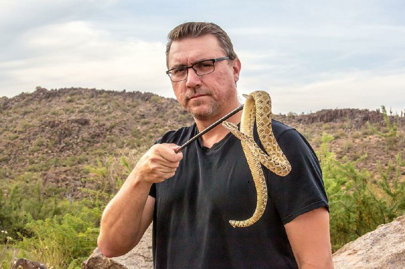 Bryan Hughes, a professional snake catcher in Arizona, appears in the Survive segment of The Amazing Human Body that deals with our fears. The special airs Wednesday on AETN 
