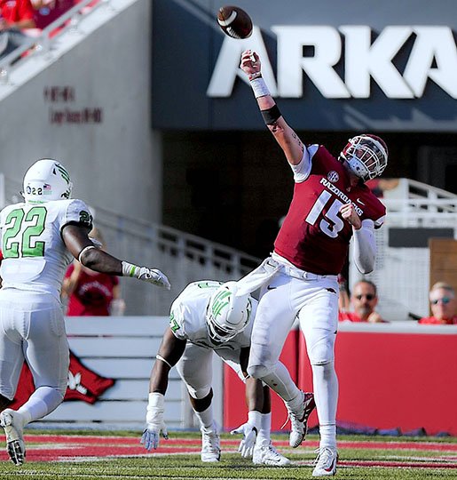 NWA Democrat-Gazette/Charlie Kaijo ILL-ADVISED: Arkansas quarterback Cole Kelley (15) heaves a pass downfield Saturday during the second quarter of the Razorbacks' 44-17 home loss to North Texas at Donald W. Reynolds Razorback Stadium in Fayetteville.